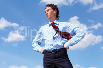 young business man in a blue shirt and red tie