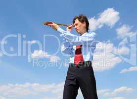 young business man  looks through a telescope