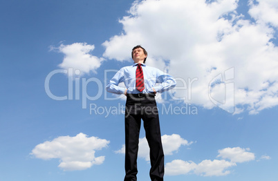 young business man in a blue shirt and red tie