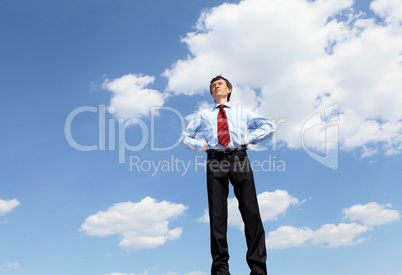 young business man in a blue shirt and red tie