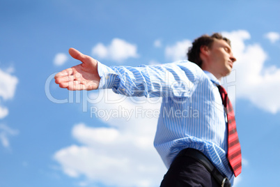 young business man in a blue shirt and red tie