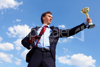 young businessman  with a golden cup