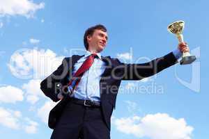 young businessman  with a golden cup