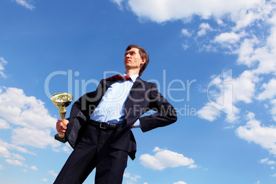 young businessman  with a golden cup