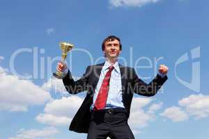 young businessman  with a golden cup