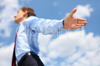 young business man in a blue shirt and red tie