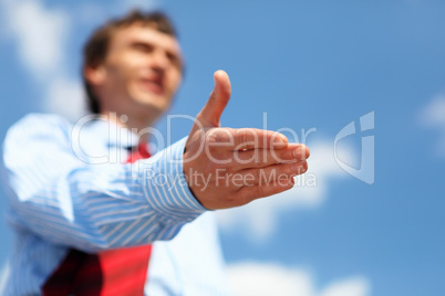 young businessman in a blue shirt and red tie