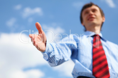 young businessman in a blue shirt and red tie