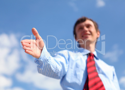 young businessman in a blue shirt and red tie