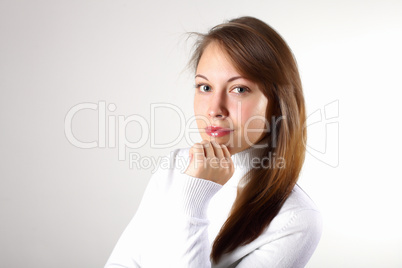 Young girl in white sweater