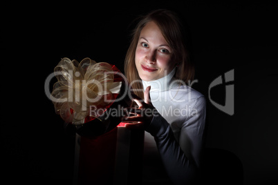 Young woman reading a magic book