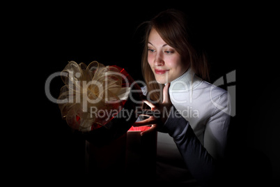 Young woman reading a magic book