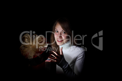 Young woman reading a magic book