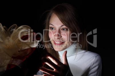 Young woman reading a magic book