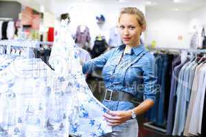 Woman in a shop buying clothes