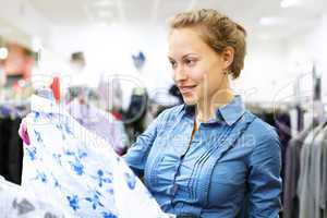 Woman in a shop buying clothes