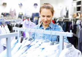 Woman in a shop buying clothes