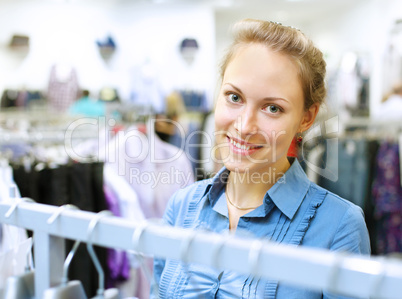 Woman in a shop buying clothes