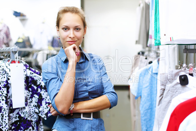 Woman in a shop buying clothes