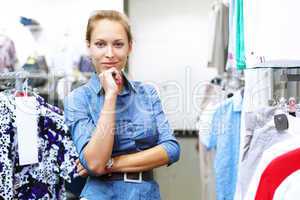 Woman in a shop buying clothes