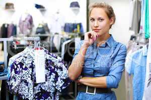 Woman in a shop buying clothes