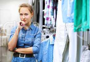 Woman in a shop buying clothes