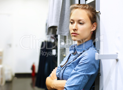 Woman in a shop buying clothes