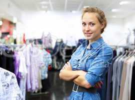 Woman in a shop buying clothes