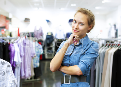 Woman in a shop buying clothes