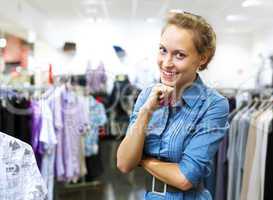 Woman in a shop buying clothes