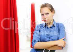 Woman in a shop buying clothes