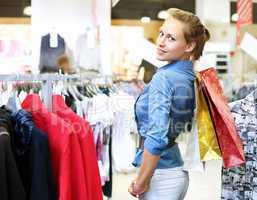 Woman in a shop buying clothes