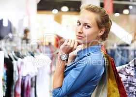 Woman in a shop buying clothes