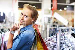 Woman in a shop buying clothes