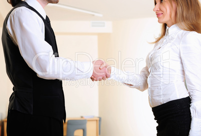 young girl shakes hands