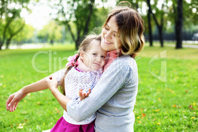 Mother and daughter in park