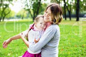 Mother and daughter in park