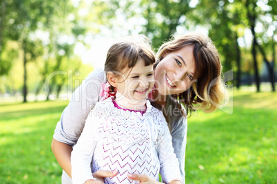 Mother and daughter in park