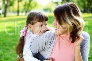 Mother and daughter in park