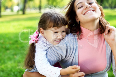 Mother and daughter in park