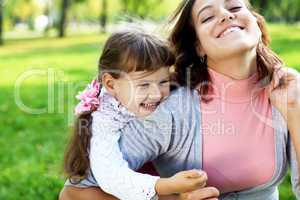 Mother and daughter in park