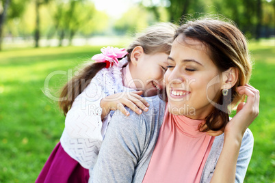 Mother and daughter in park