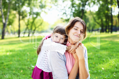 Mother and daughter in park