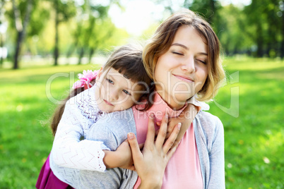 Mother and daughter in park