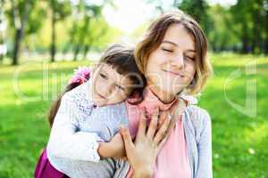 Mother and daughter in park