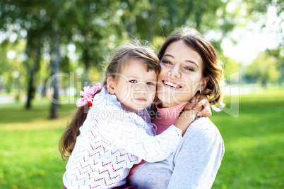 Mother and daughter in park