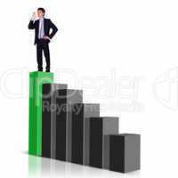 Businessman on Top of financial charts