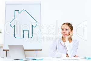 Young woman generating ideas in office