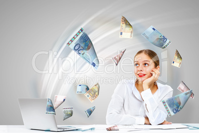 Businesswoman  at workplace and money symbols