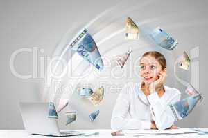 Businesswoman  at workplace and money symbols